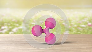 Pink xrp ripple gold sign icon on blur field of flowers. 3d render isolated illustration, cryptocurrency, crypto, business,
