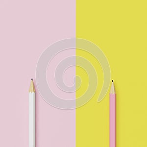 Pink and yellow pencils on pastel pink and yellow contrast background.