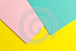 Pink yellow and turquoise paper texture background Color. Trending colors, geometric background of the paper. Colorful soft paper