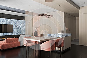 Pinkish Velvet Dining Chairs with Wooden Table next to Kitchen Counter