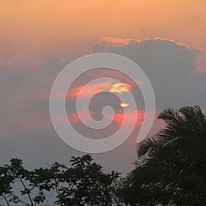 Pinks purples and oranges,backlit thunder cloud