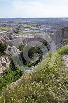 Pinnacles Overlook in Badland national park during summer. From grassland to valley. Badland landscape South Dakota