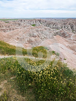 Pinnacles Overlook in Badland national park during summer. From grassland to valley. Badland landscape South Dakota