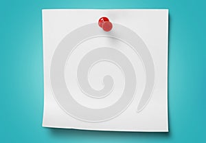 Pinned blank paper note on gray background