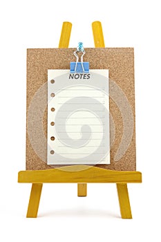 Pinned note on corkboard with wooden stand