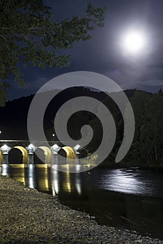 Pinofranqueado stone bridge in Las Hurdes under the moon