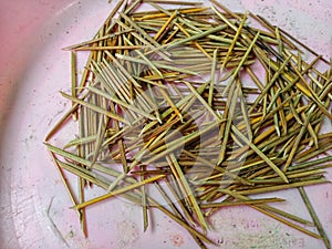 pins made of sticks (coconut) to embed the wrapping leaves