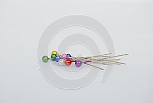 Pins with multi-colored round heads.