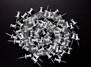 Pins and stationery on a black background