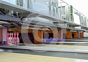 Pinsetter in the bowling alley. Pinsetter installed pins. A game photo