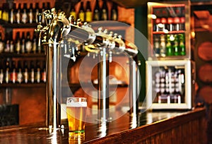 Pint of beer on a bar in a traditional style pub