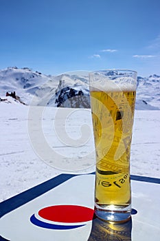 Pint of cold beer with Alps mountain