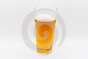 Pint of cold lager beer in a glass d isolated on a white background