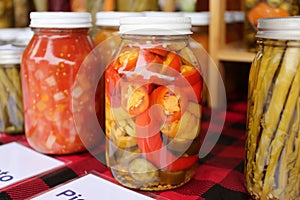 Pint Jars Filled with Salsa and Canned Vegetables for Sale at Farmer`s Market