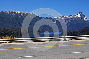San Martin de los Andes -Argentina asphalt route without people -Lakar lake background with mountain photo