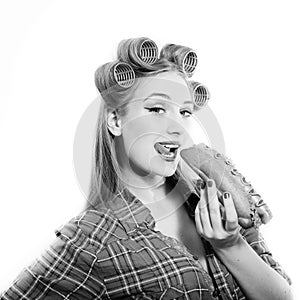Pinup beautiful blond young woman in curlers