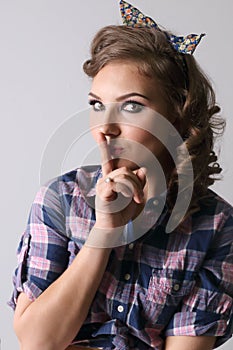 Pinup beautiful woman in checkered shirt photo