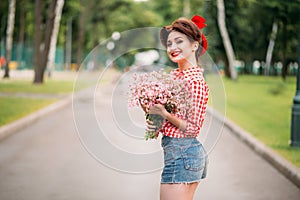Pinup girl with bouquet of flowers, retro fashion