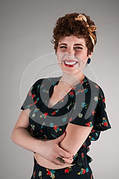 Pinup Girl in Flowered Outfit Grins