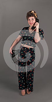 Pinup Girl in Flowered Outfit with Phone