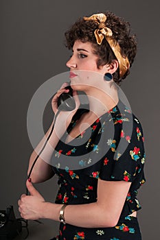 Pinup Girl in Flowered Outfit on Phone - Serious