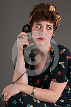 Pinup Girl Looks Upset by Phone News