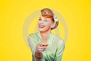 Pinup girl pointing at you smiling laughing