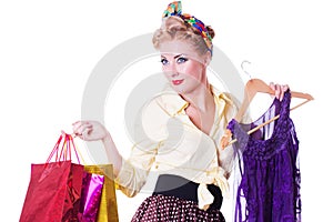 Pinup girl with shopping bags and dress