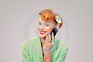 Pinup girl talking on smartphone smiling