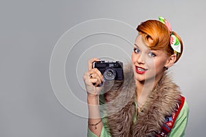 Pinup style woman girl with digital camera