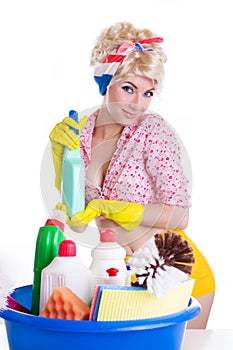 Pinup woman with cleaning set