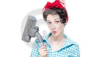 Pinup woman and vacuum cleaner