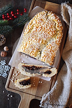 Pinza bolognese. Italian Christmas pastry. Sweet New Year`s pie with filling on wooden background