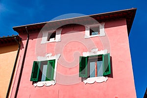 Piombino, Tuscany, Italy. Cute window with decoration in sunlight