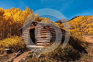 Pioneer Log Cabin in Colorado with Fall Colors