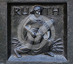 The pious Ruth, relief on the door of the Grossmunster church in Zurich photo