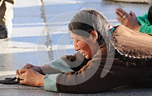 Pious tibet prayer in jokhang temple