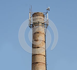 Pipe with antennas sky background