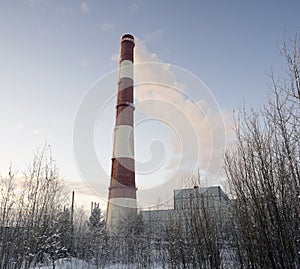 Pipe city boiler house with smoke coming .