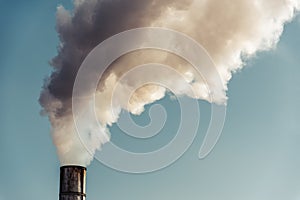 The pipe of the factory polluting air. Environment concept.