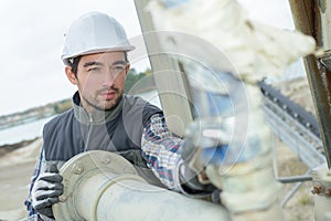 Pipe fitter checking connections