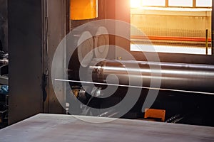 Pipe formation by using roll bending machine, close up