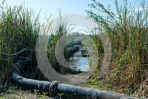 Pipe is installed along the bridge on the pipe support. Water steel pipes for community utilities