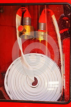 Pipe roll for fire hose emergency in red metal boxes