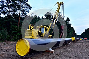 Pipelayer with side boom Installation of  gas and crude oil pipes in ground. Construction of the gas pipes to new LNG plant