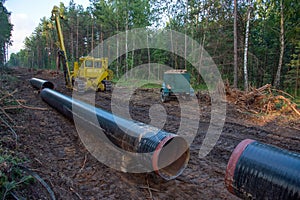 Pipelayer with side boom Installation of  gas and crude oil pipes in ground. Construction of the gas pipes to new LNG plant