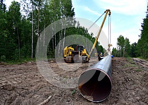 Pipelayer with side boom Installation of  gas and crude oil pipes in ground. Construction Natural Gas Pipeline Project