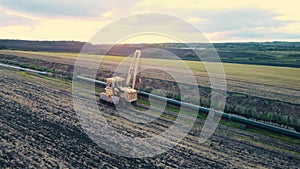 Pipeline construction. Tractor pipelayer lays a gas pipeline. Construction of a new gas pipeline. Construction of the