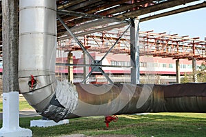 Pipeline estocada, large pipe with steam in insulation made of glass wool with red ventrals, fittings, valves, drainage with blue