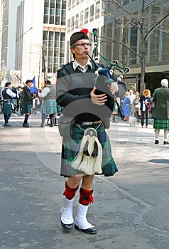 A piper At The Tartan Day Parade